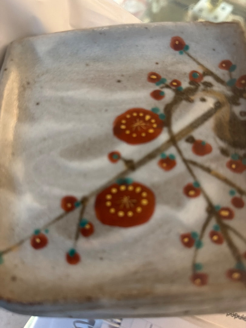 4 small pottery plates