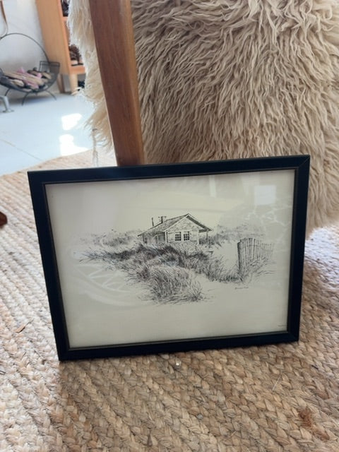 Framed coastal home scene