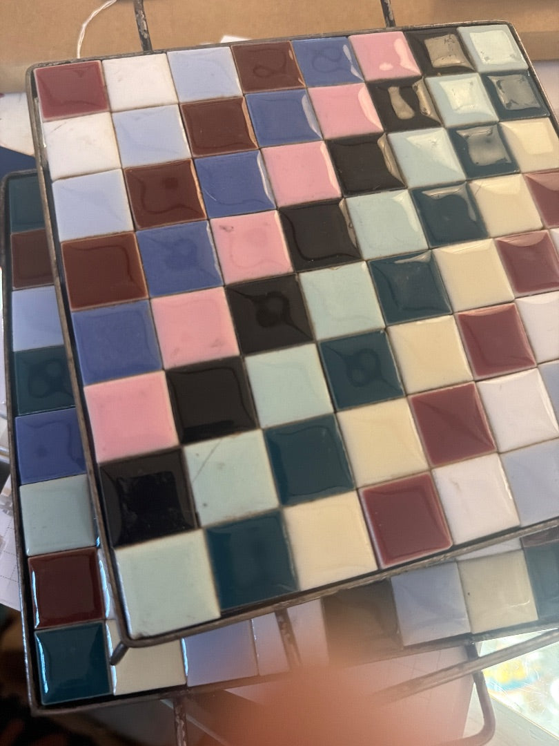 2 tiled trivets