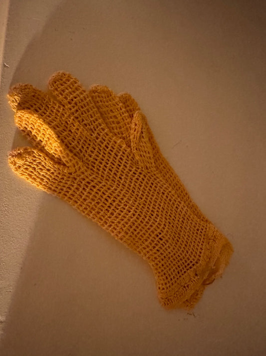 Yellow knit gloves