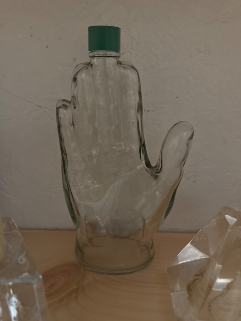 Vintage glass hand bottle