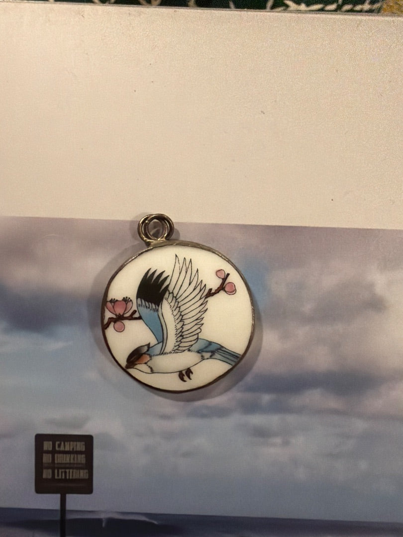 Teacup enamel bird pendant