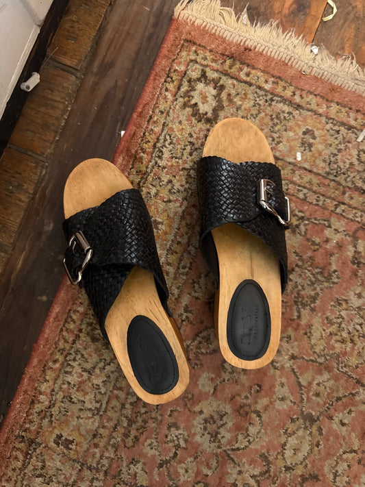 Black buckle clogs
