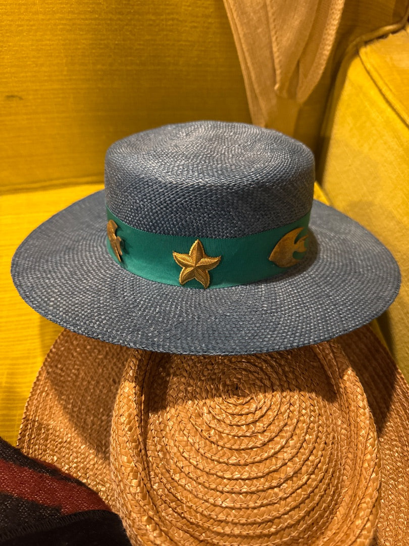 Blue straw hat w brass sea pins
