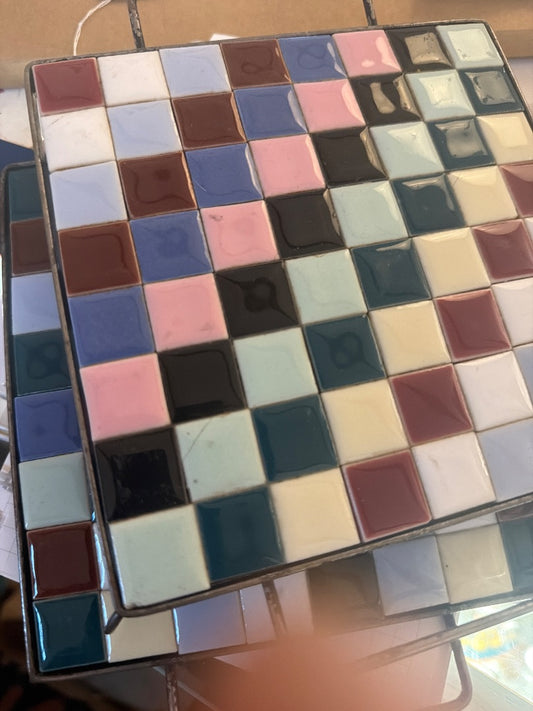 2 tiled trivets